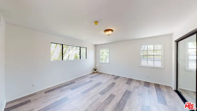 a view of an house with backyard space and garden