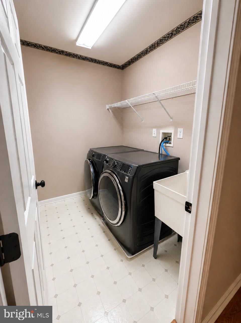 141 Coburn Road Pennington, NJ 08534 - Photo 45 of 53 Modern laundry room with sleek appliances.