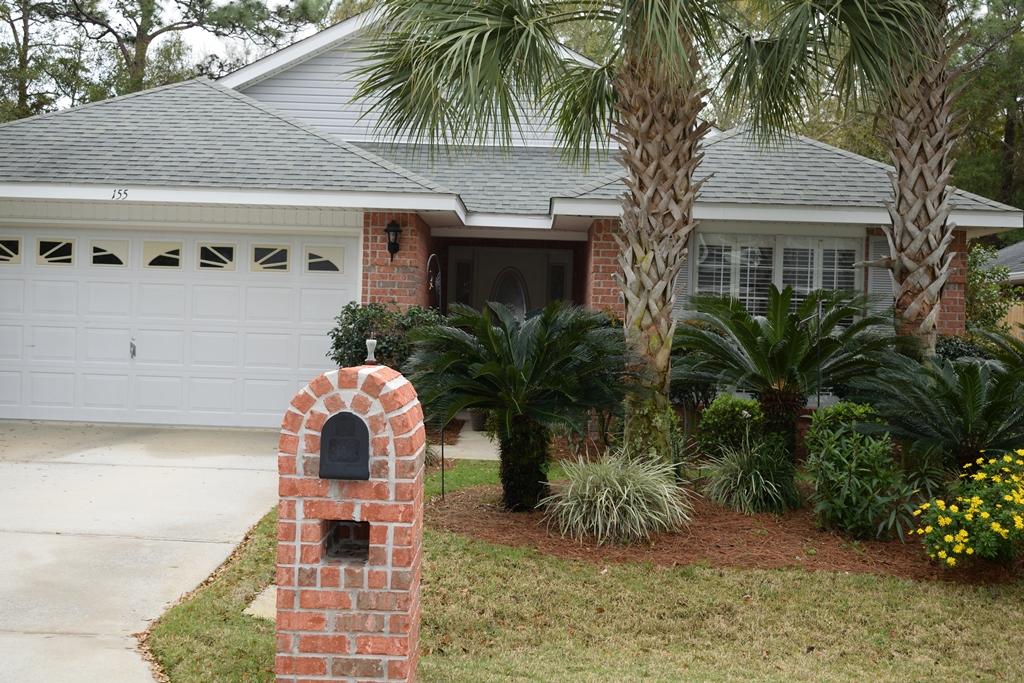155 Bayou Landing Road Miramar Beach, FL 32550 - Photo 1 of 34 a front view of house with yard space and trees in the background