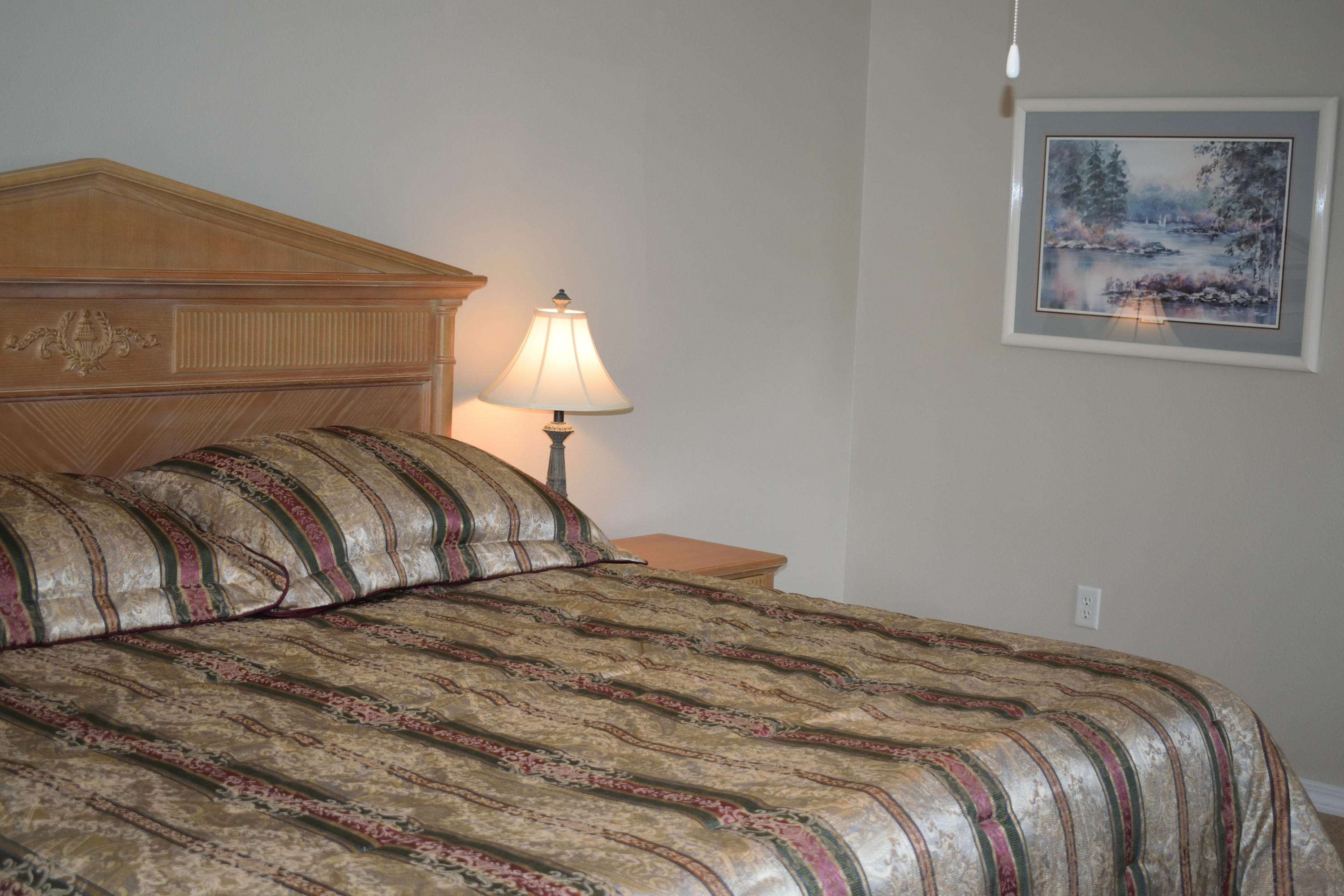 155 Bayou Landing Road Miramar Beach, FL 32550 - Photo 15 of 34 a bedroom with a bed and a lamp