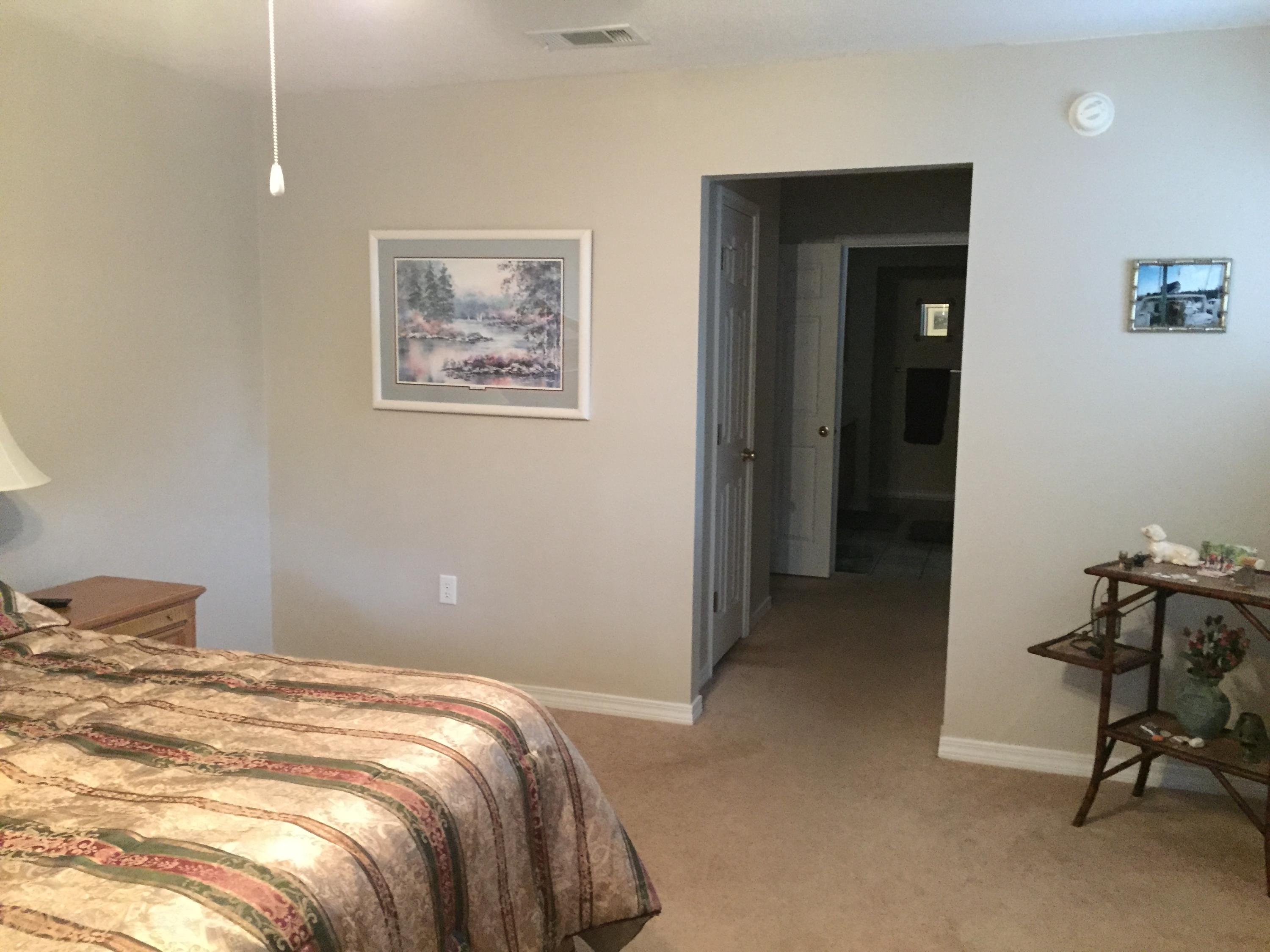 155 Bayou Landing Road Miramar Beach, FL 32550 - Photo 17 of 34 a bedroom with a bed and a chair