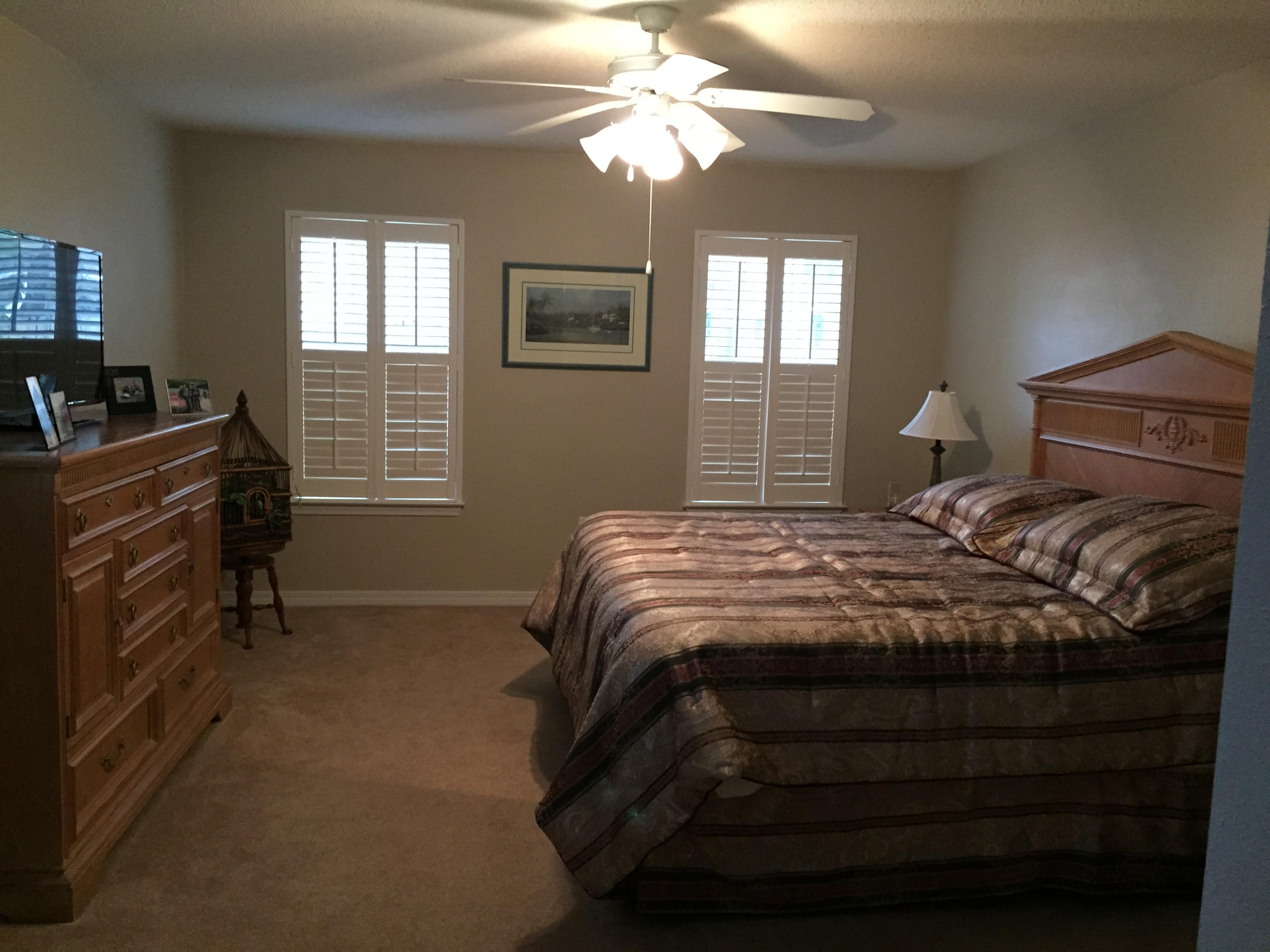 155 Bayou Landing Road Miramar Beach, FL 32550 - Photo 19 of 34 a bedroom with a bed and a chandelier