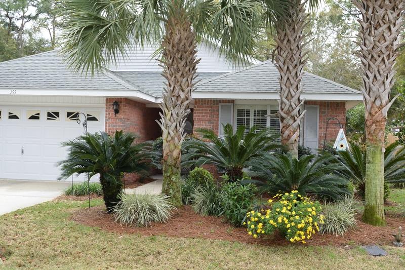 155 Bayou Landing Road Miramar Beach, FL 32550 - Photo 2 of 34 a plant in front of a white house
