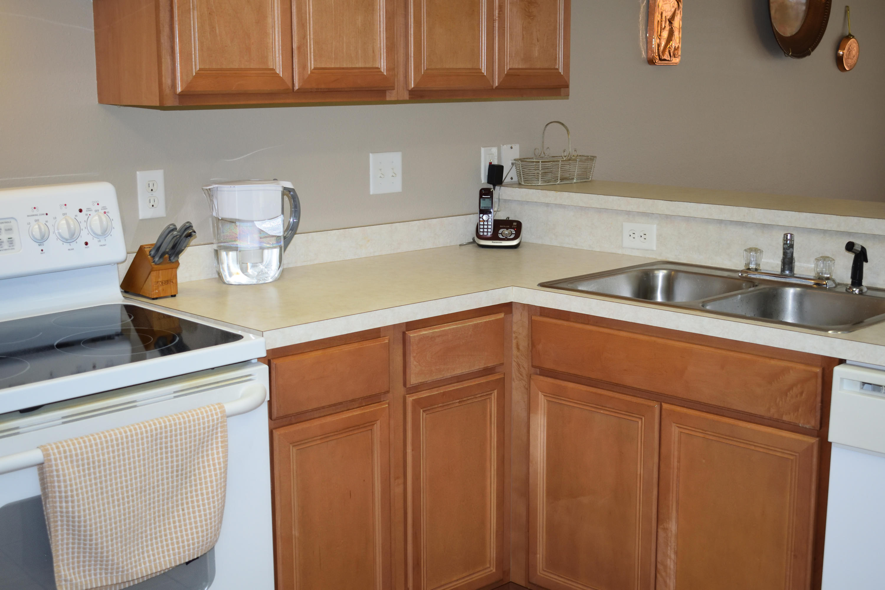 155 Bayou Landing Road Miramar Beach, FL 32550 - Photo 23 of 34 a kitchen with stainless steel appliances granite countertop a sink a stove and cabinets
