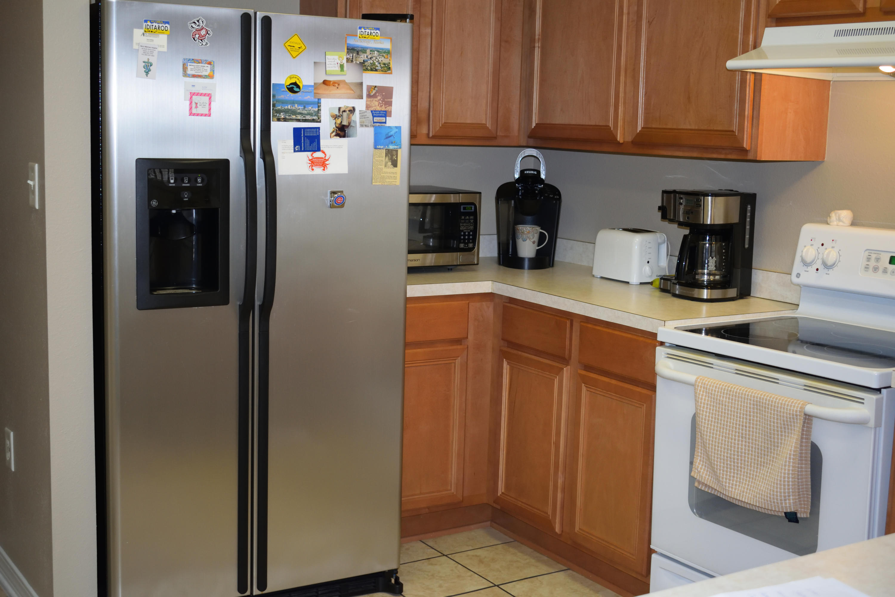 155 Bayou Landing Road Miramar Beach, FL 32550 - Photo 24 of 34 a kitchen with stainless steel appliances granite countertop a refrigerator and a sink