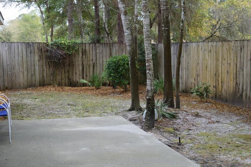 155 Bayou Landing Road Miramar Beach, FL 32550 - Photo 32 of 34 a backyard of a house with lots of green space