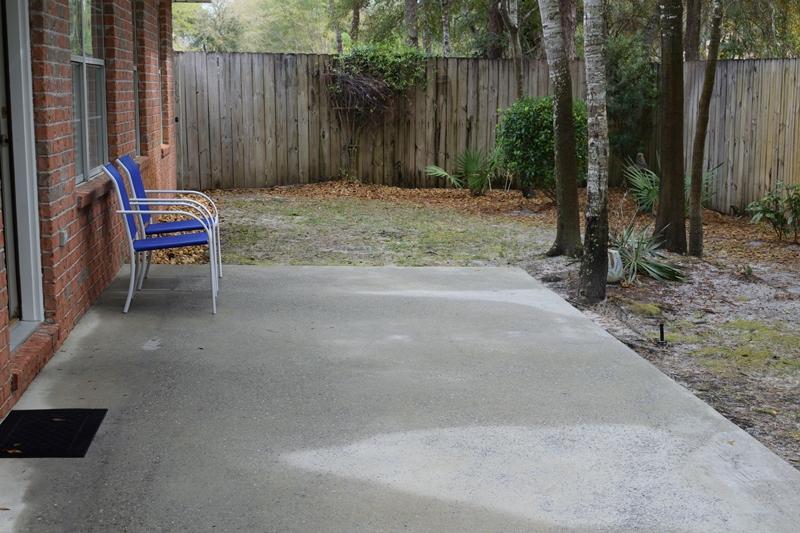 155 Bayou Landing Road Miramar Beach, FL 32550 - Photo 34 of 34 a backyard of a house with lawn chairs and wooden fence