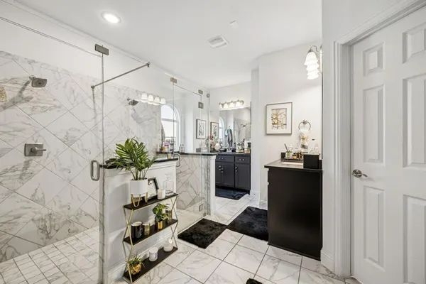 a bedroom with furniture and flat screen tv