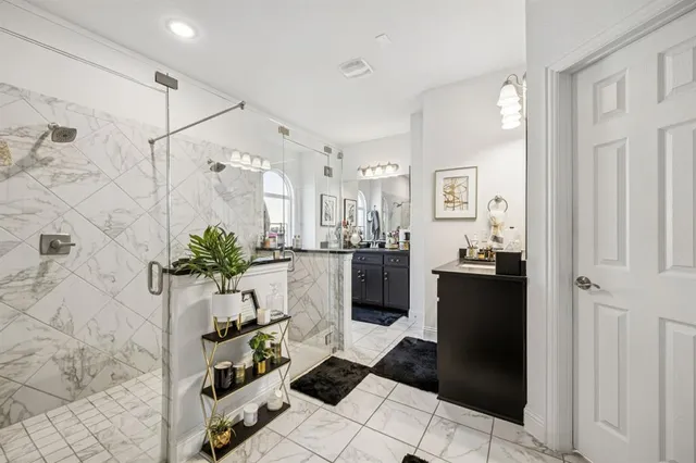 a bedroom with furniture and flat screen tv