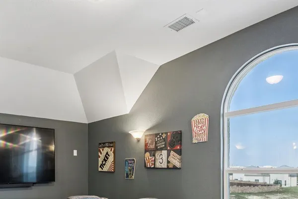 a view of a hallway with paintings on the wall