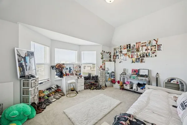 a room with toys and a wooden floor
