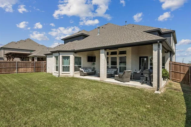 a house view with a sitting space and garden space
