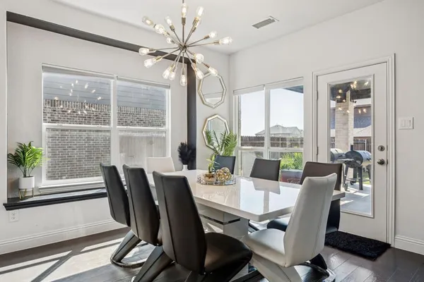 a kitchen with a stove and white cabinets