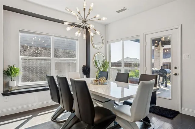 a kitchen with a stove and white cabinets