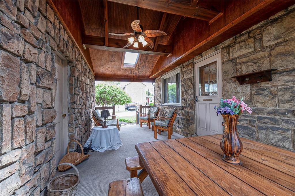 699 Kaye Avenue Monaca, PA 15061 - Photo 7 of 43 a view of a patio with table and chairs potted plants with wooden floor