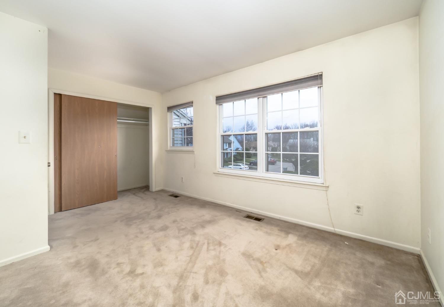 1403 Maplecrest Road Edison, NJ 08820 - Photo 12 of 23 an empty room with windows