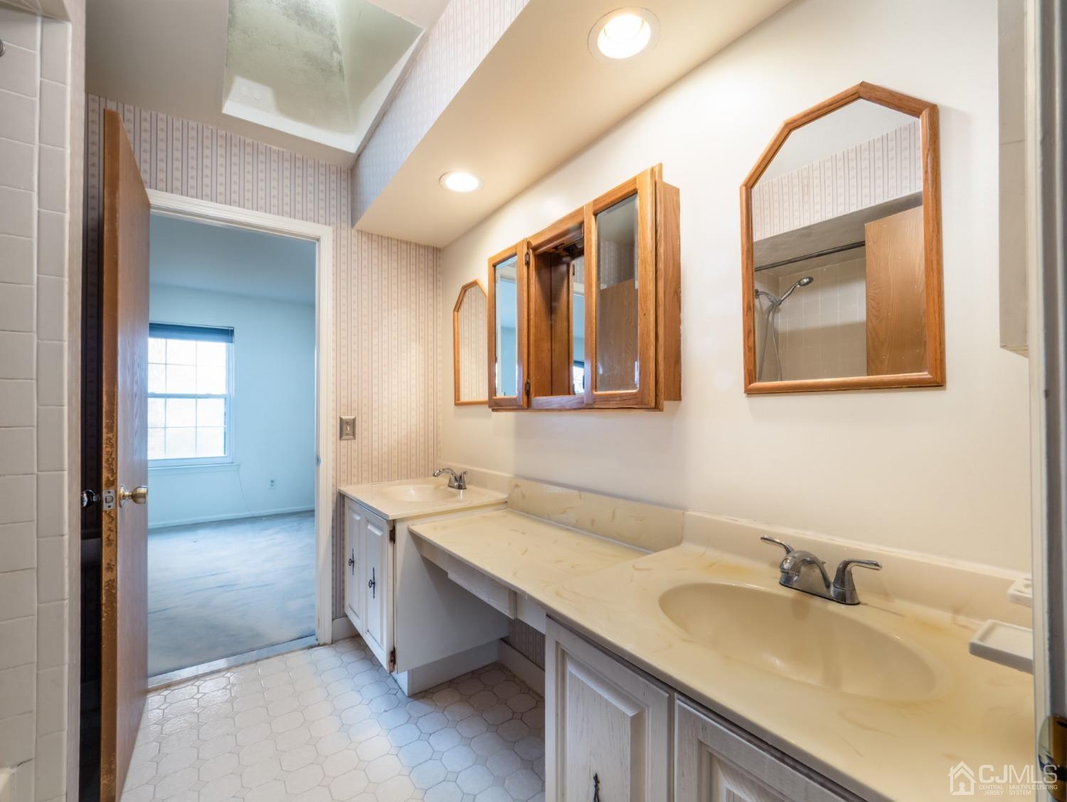 1403 Maplecrest Road Edison, NJ 08820 - Photo 15 of 23 a bathroom with a granite countertop sink mirror and double