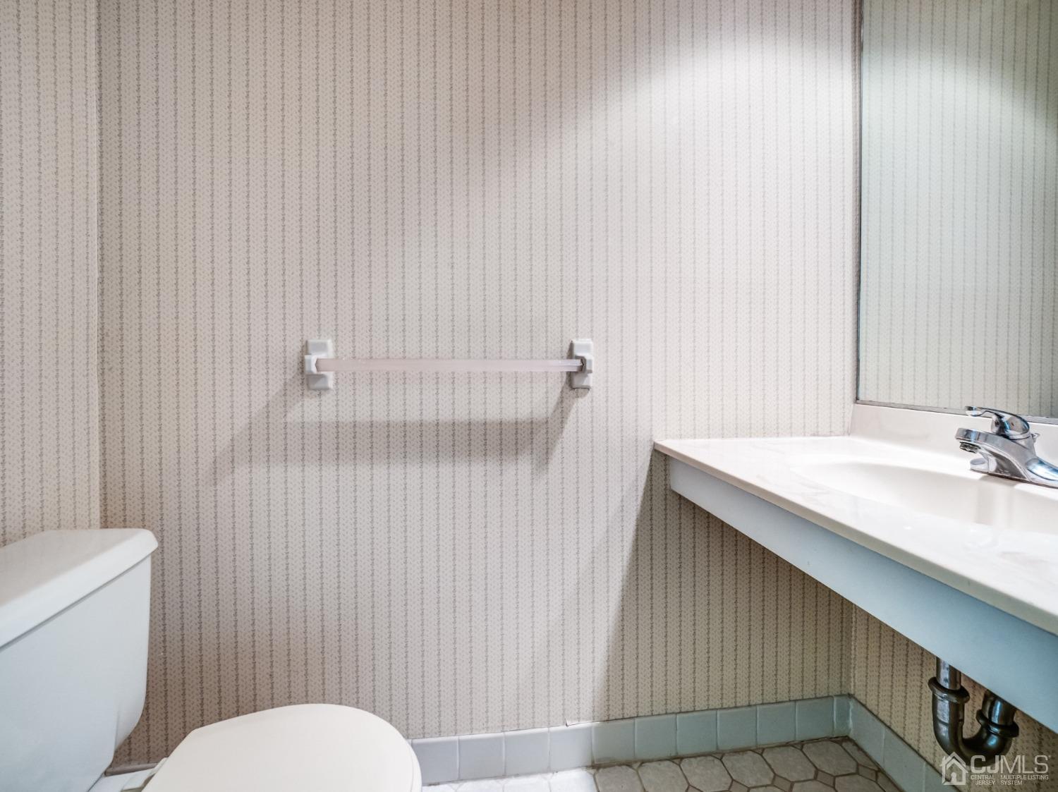 1403 Maplecrest Road Edison, NJ 08820 - Photo 18 of 23 a bathroom with a sink toilet and shower