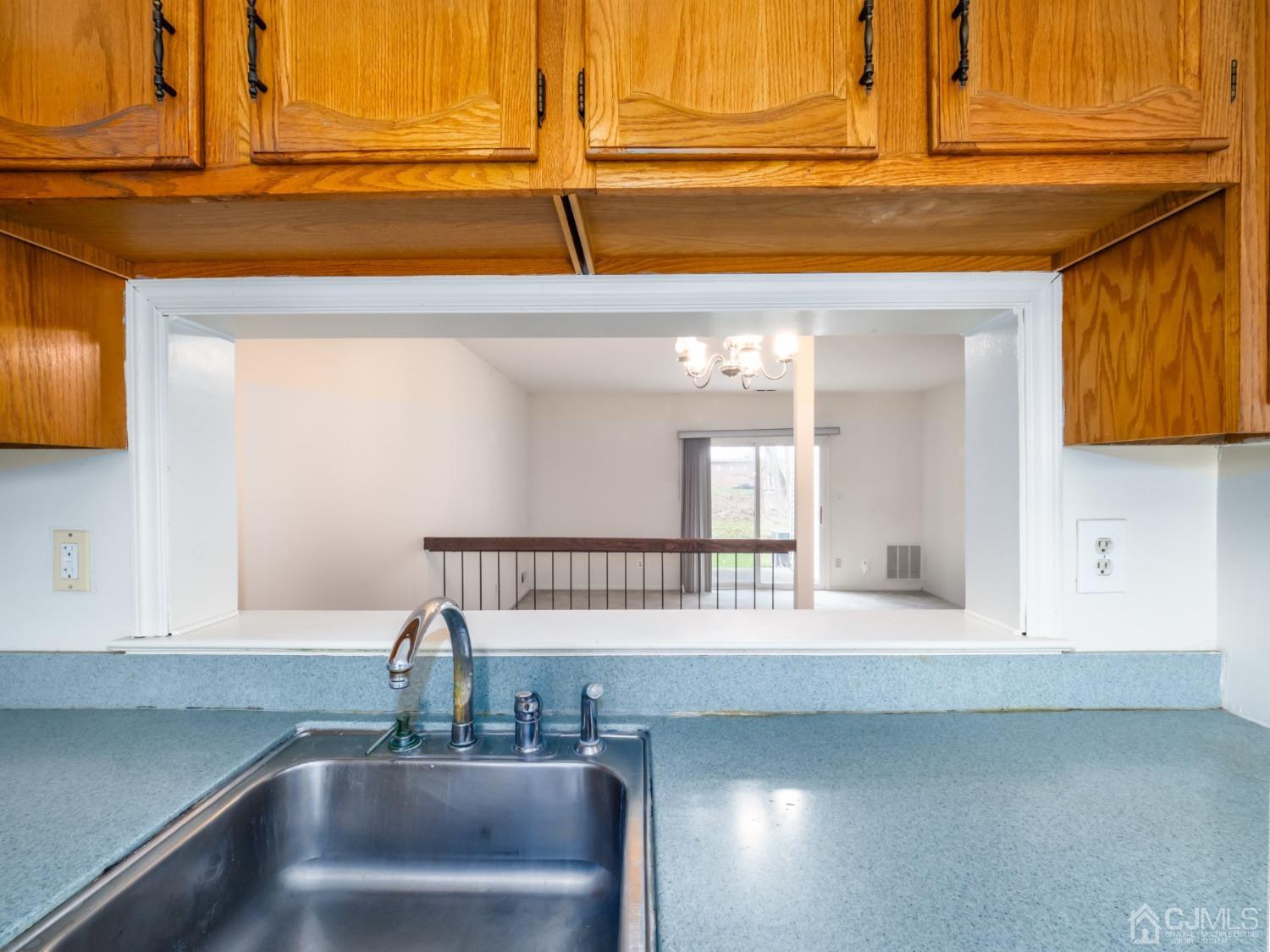 1403 Maplecrest Road Edison, NJ 08820 - Photo 6 of 23 a kitchen with a sink and a window