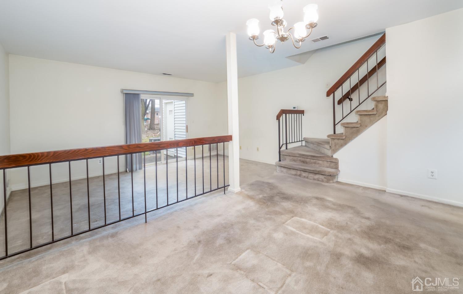 1403 Maplecrest Road Edison, NJ 08820 - Photo 8 of 23 a view of a chandelier fan and entryway