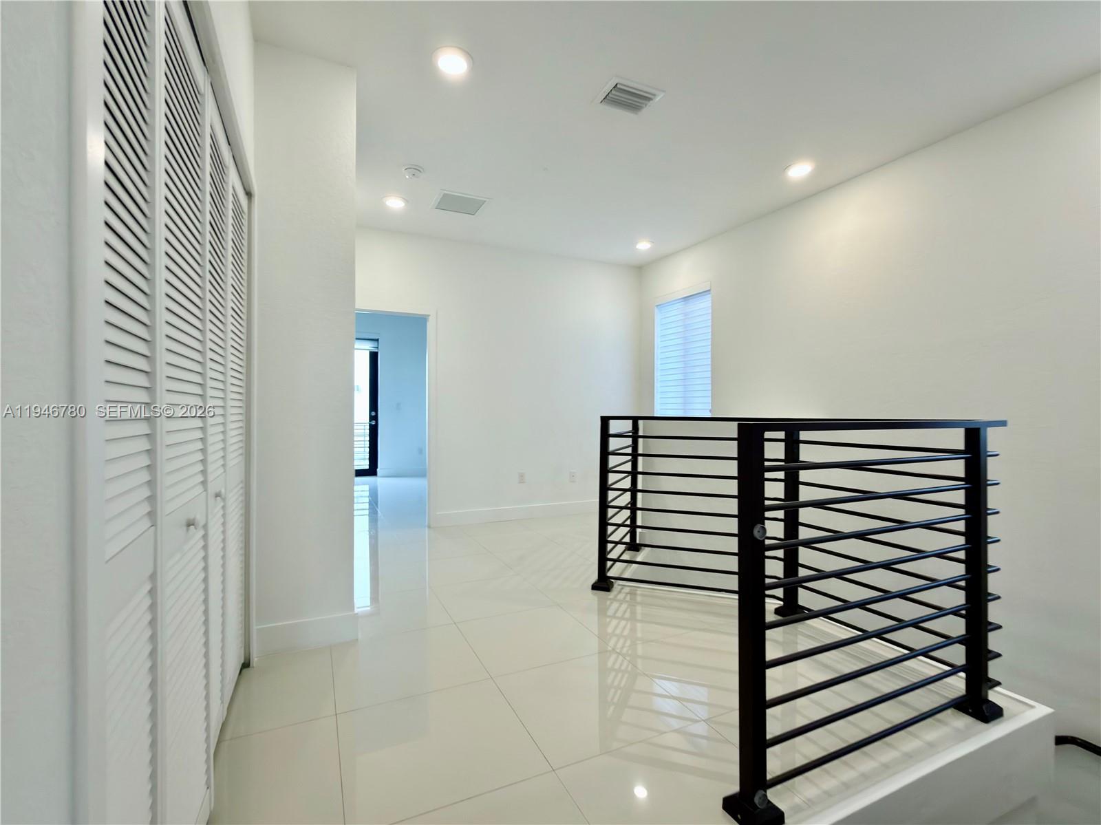 404 Southwest 91st Court Miami, FL 33174 - Photo 18 of 21 a view of a hallway with stairs and a couch