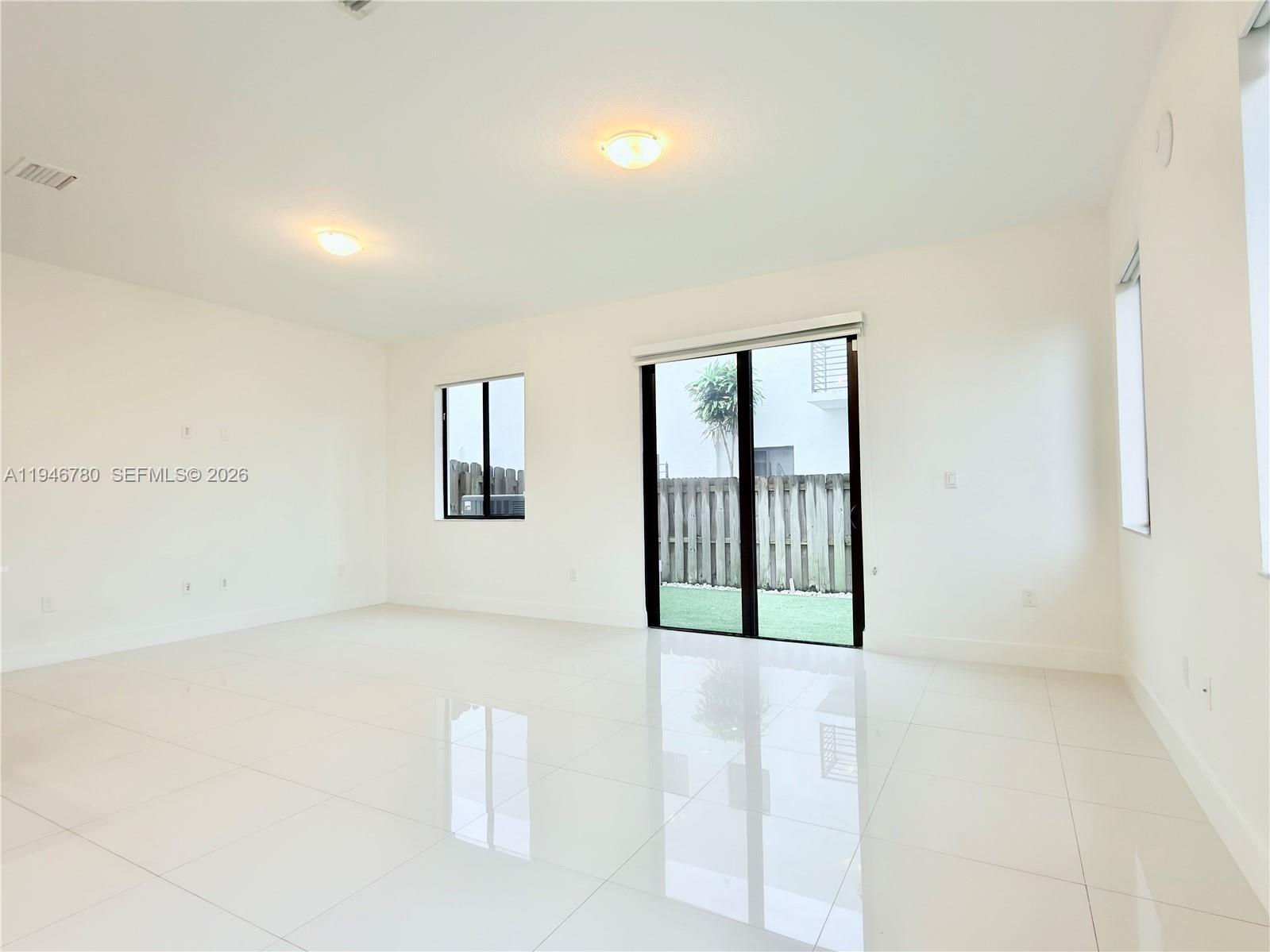 404 Southwest 91st Court Miami, FL 33174 - Photo 5 of 21 a view of an empty room with glass door