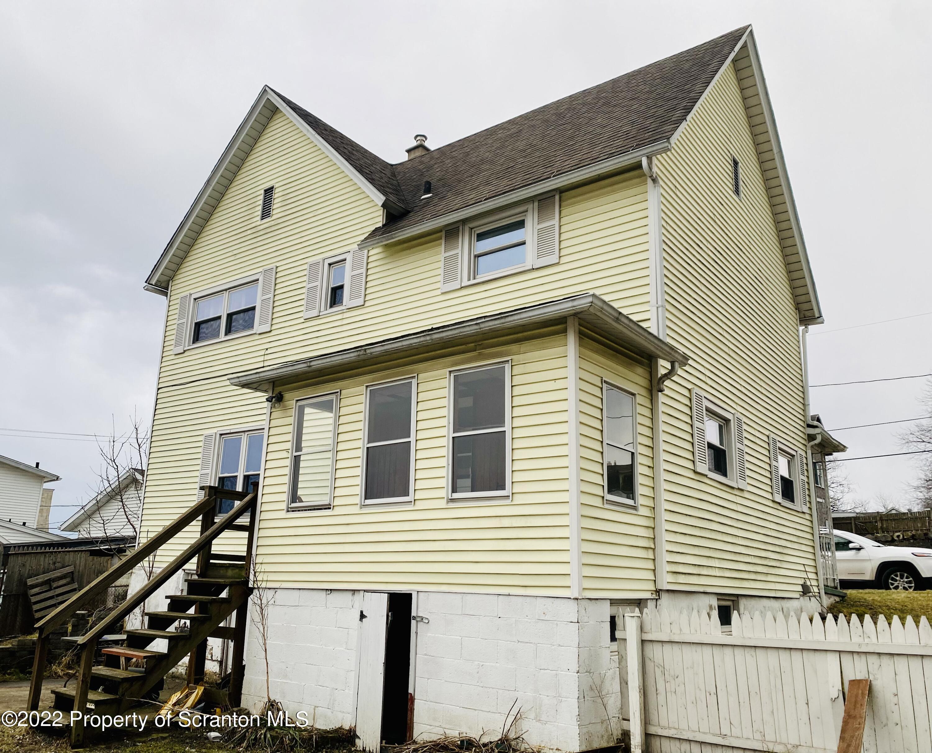 1102 Pierce Street Scranton, PA 18508 - Photo 2 of 10 a front view of a house with stairs