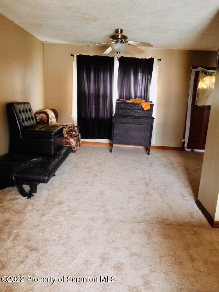 1102 Pierce Street Scranton, PA 18508 - Photo 5 of 10 a bed room with a bed and a television