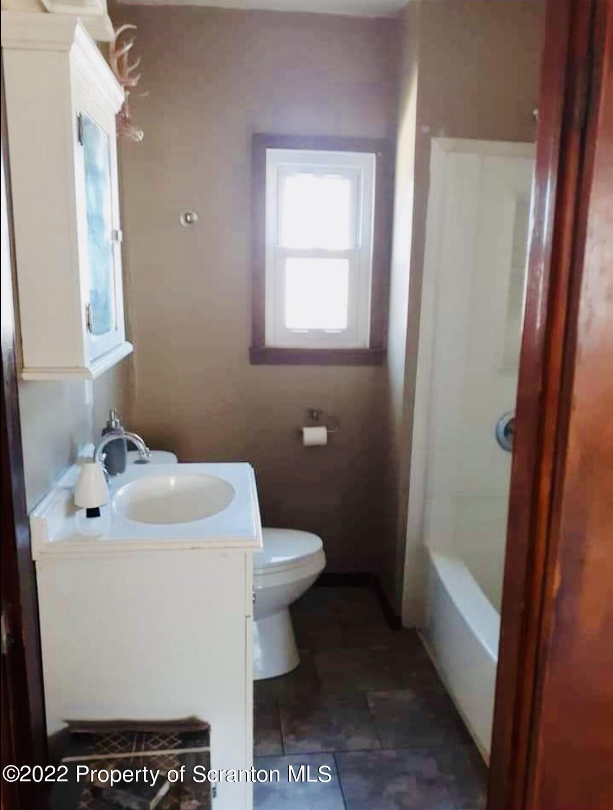 1102 Pierce Street Scranton, PA 18508 - Photo 9 of 10 a bathroom with a sink toilet and shower