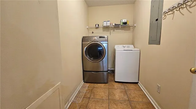a view of a storage & utility room with washer and dryer