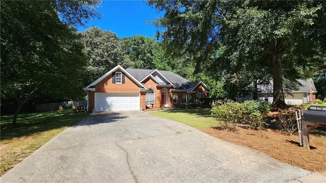 a house with trees in the background