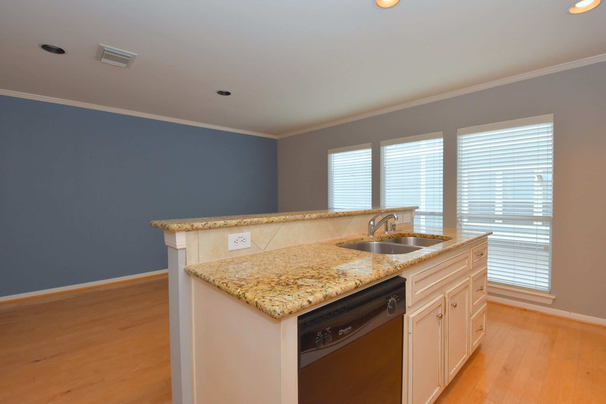 1267 West 17th Street Houston, TX 77008 - Photo 12 of 22 Charming central island with sleek granite countertop, perfect for casual dining or entertaining in this sunlit, spacious kitchen.