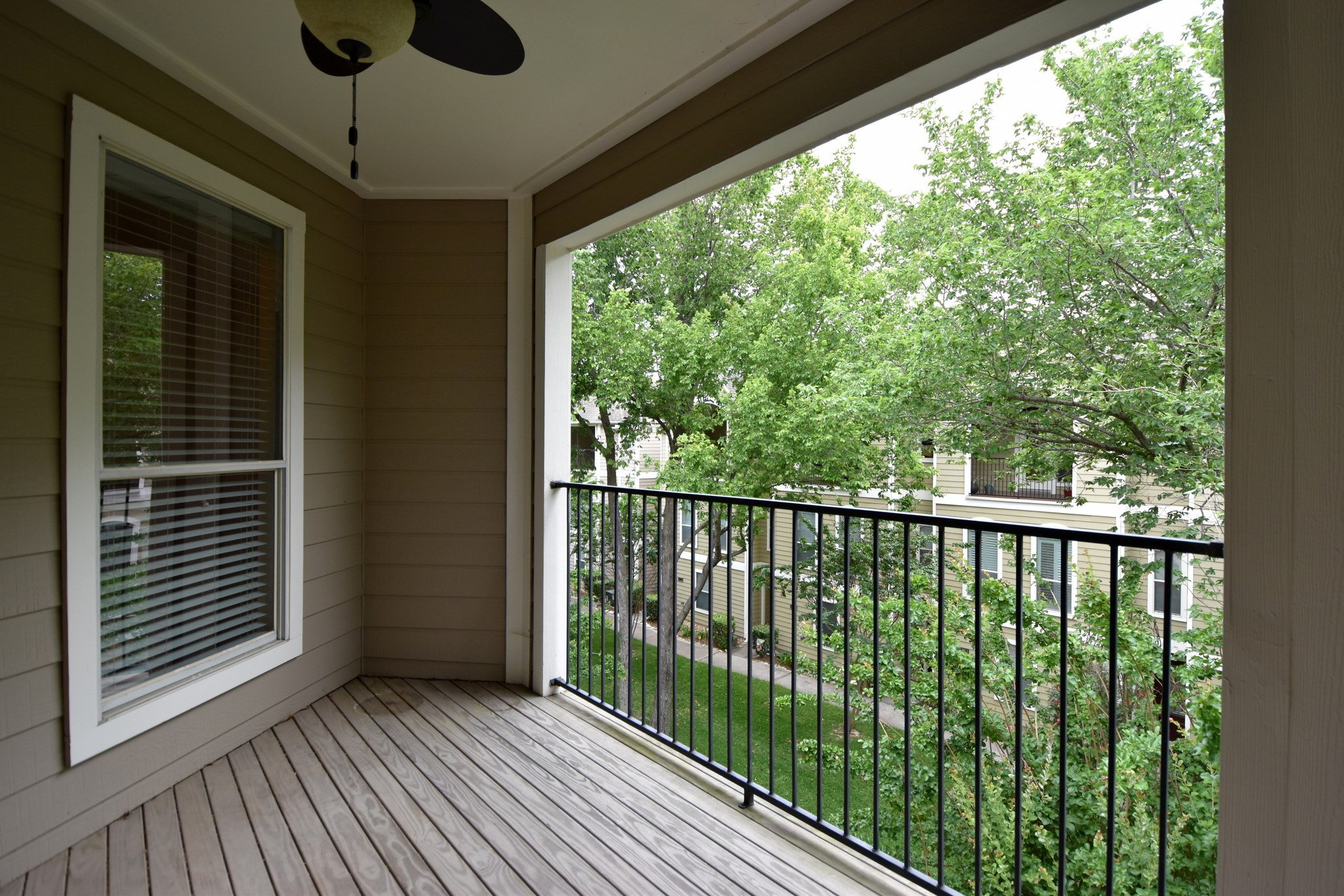 1267 West 17th Street Houston, TX 77008 - Photo 19 of 22 Private top-floor balcony with serene tree-lined views.