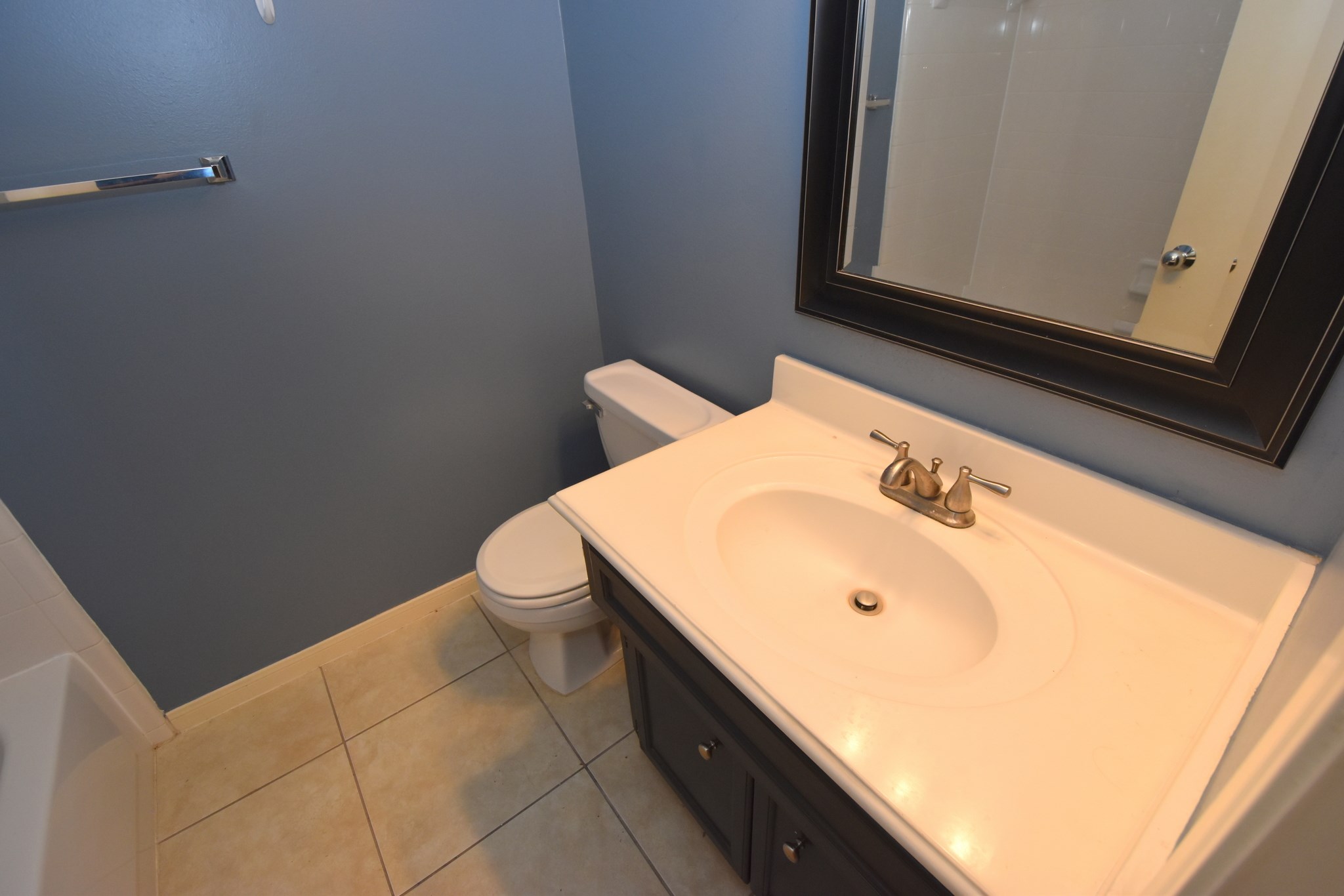 1267 West 17th Street Houston, TX 77008 - Photo 5 of 22 Chic ground-level powder room with modern fixtures and sleek design.