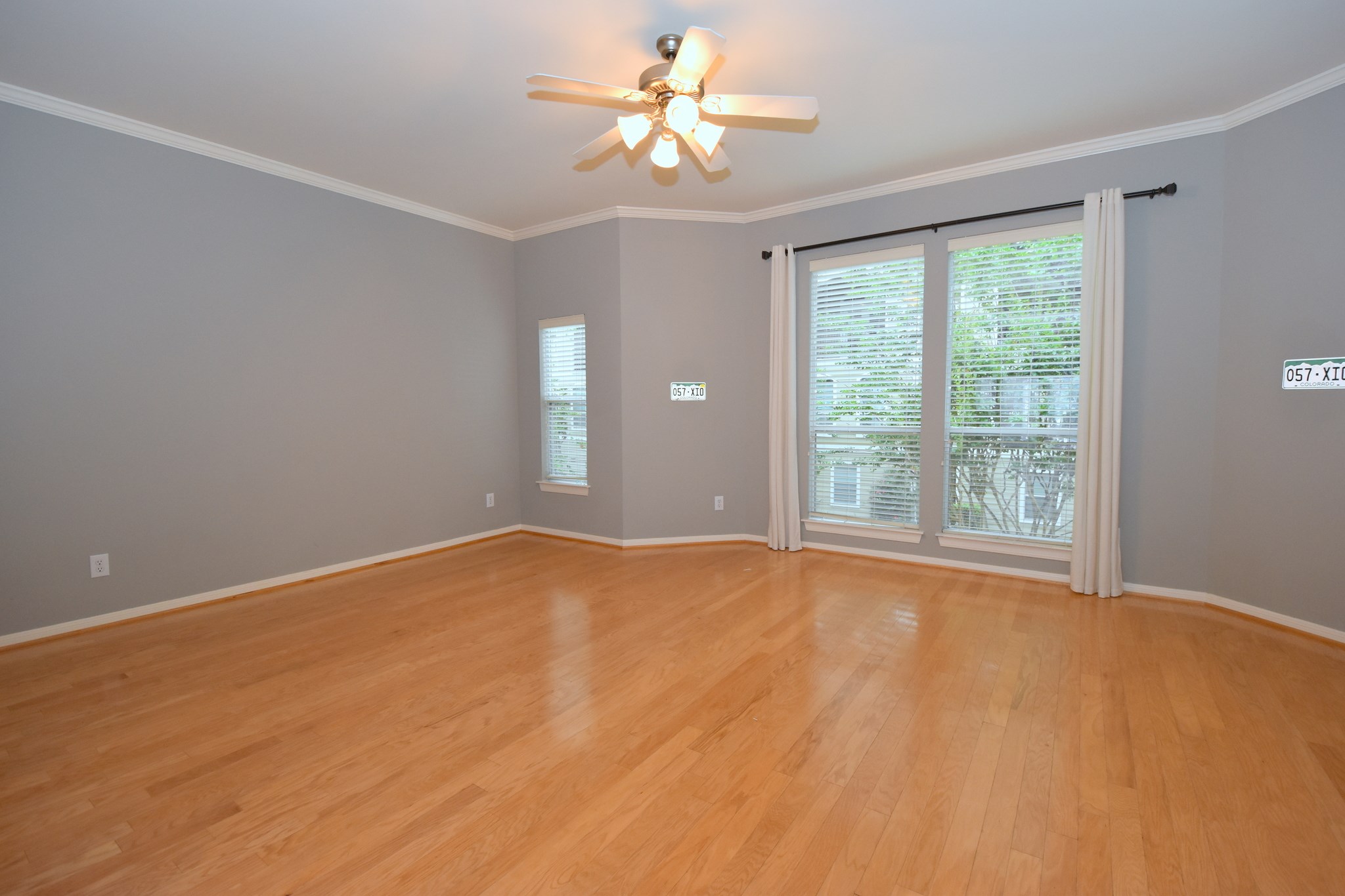 1267 West 17th Street Houston, TX 77008 - Photo 7 of 22 Spacious and sunlit second-floor living room with elegant hardwood flooring and a charming balcony view.