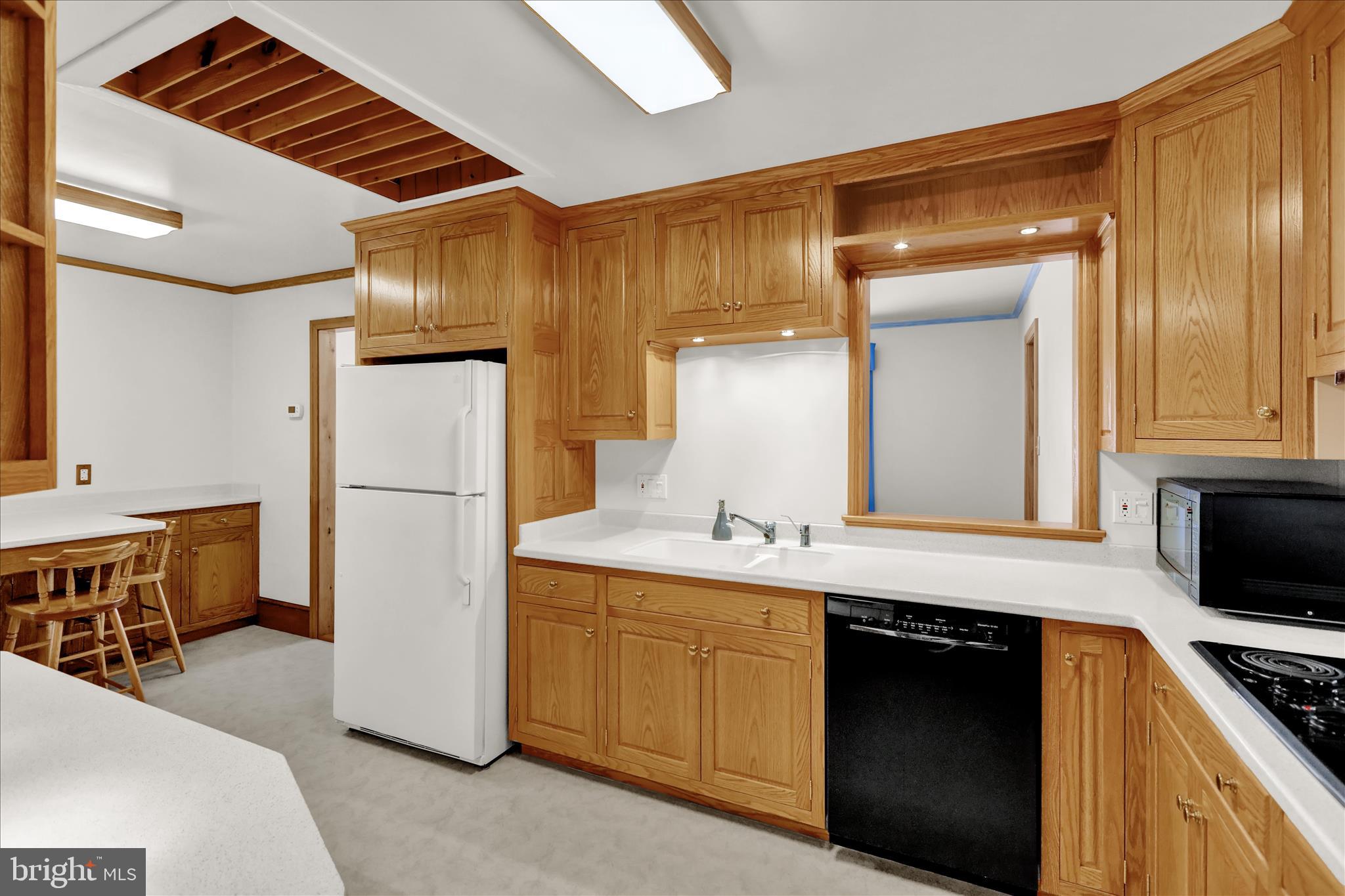 2904 Gerard Avenue Reading, PA 19608 - Photo 13 of 39 a kitchen with a sink and refrigerator