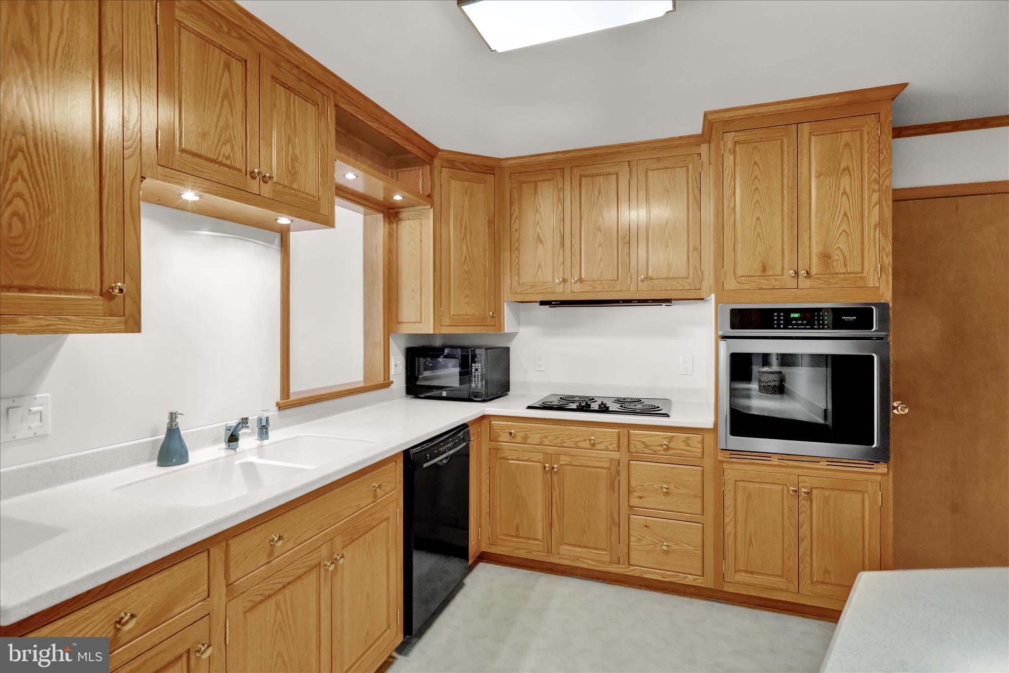 2904 Gerard Avenue Reading, PA 19608 - Photo 10 of 39 a kitchen with a sink cabinets and stainless steel appliances