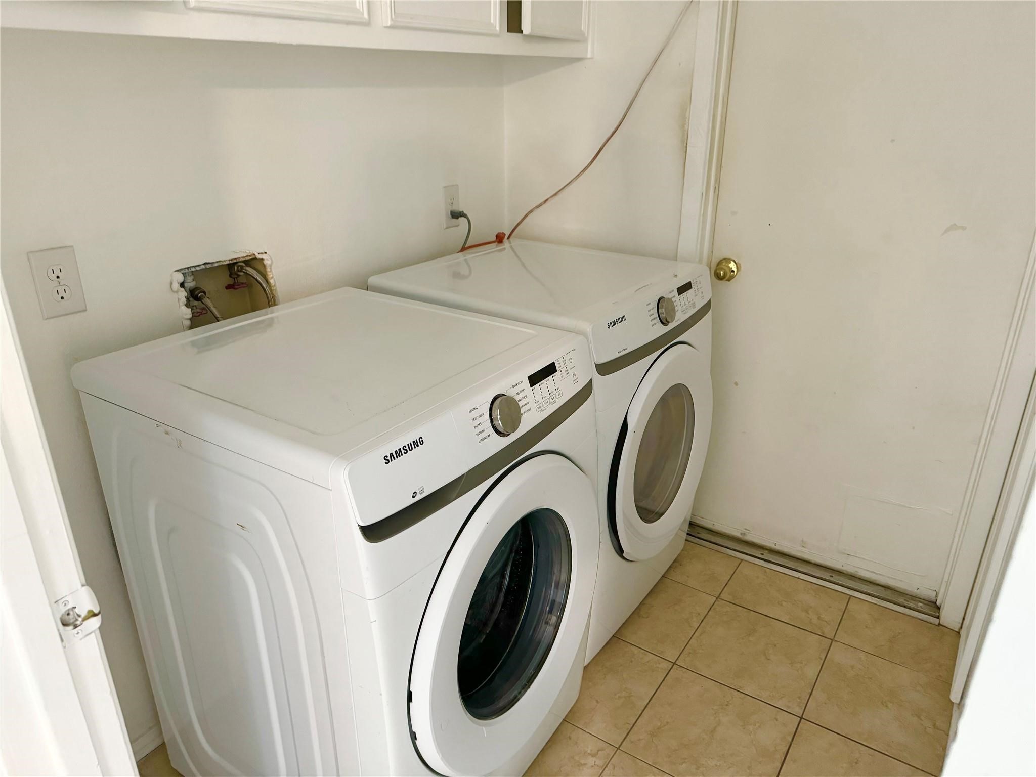 7015 Pyron Way Houston, TX 77036 - Photo 12 of 12 a utility room with dryer and washer