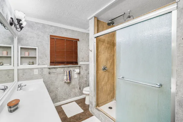 a bathroom with a tub and a shower