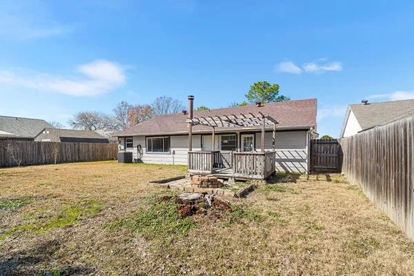 a view of a deck with wooden floor and fence