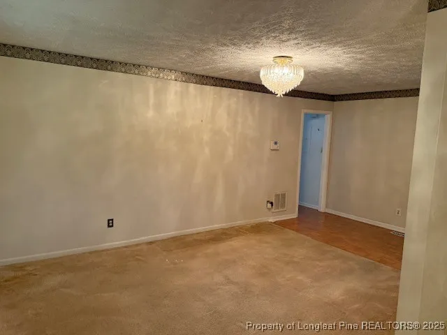 a kitchen with granite countertop a stove and a sink