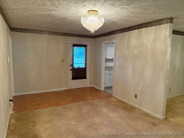 a view of an empty room with a fireplace
