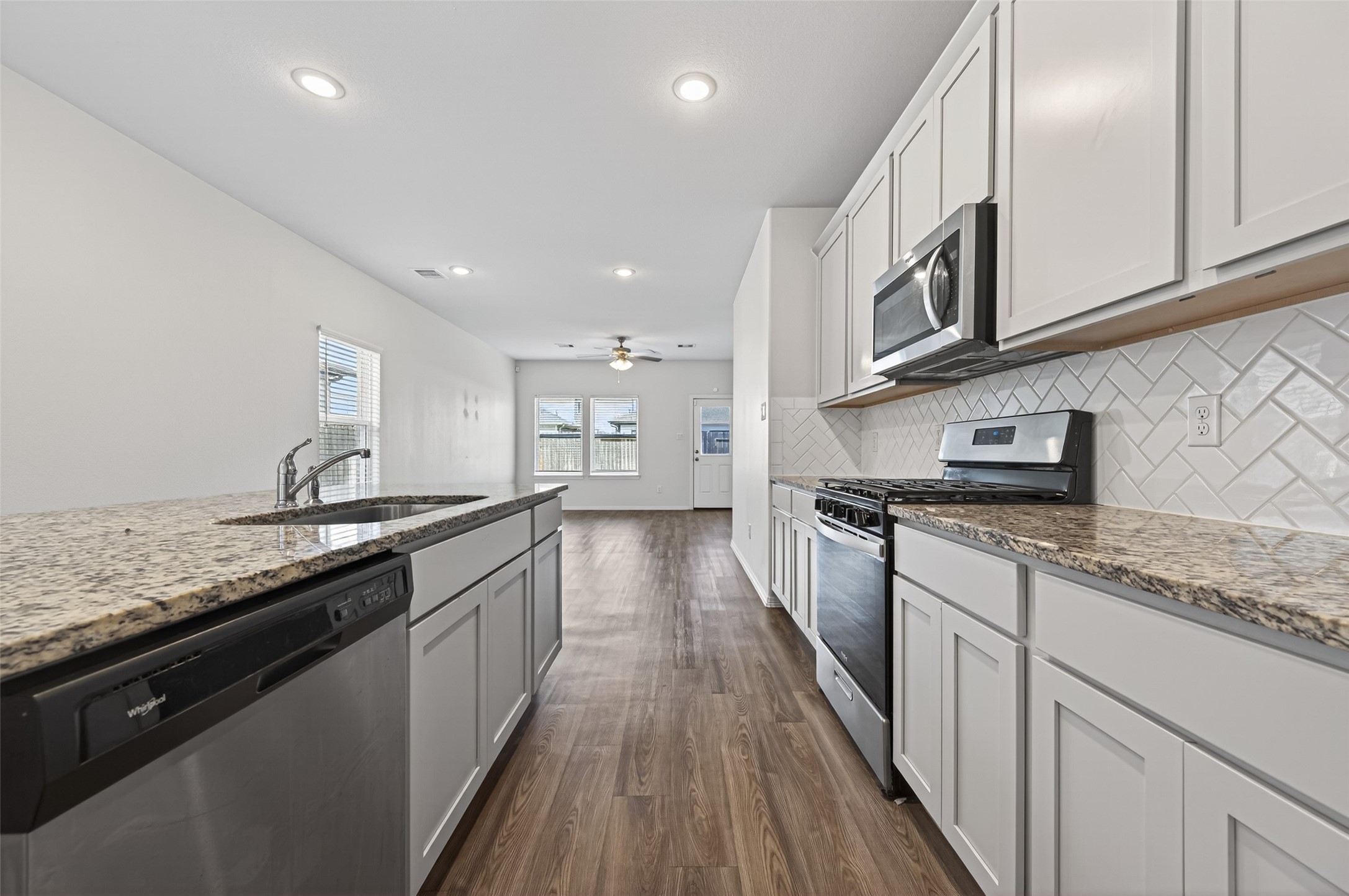 23222 Spring Genesis Lane Katy, TX 77493 - Photo 19 of 43 Stylish backsplash enhances the kitchen's modern appeal.