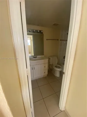a bathroom with a toilet and shower