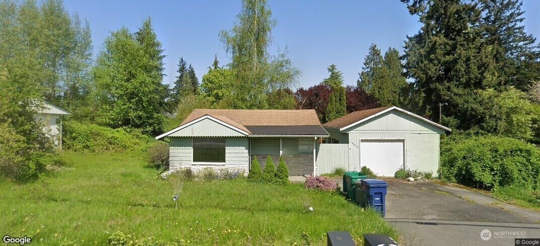 19915 Filbert Drive Bothell, WA 98012 - Photo 1 of 1 a front view of a house with garden