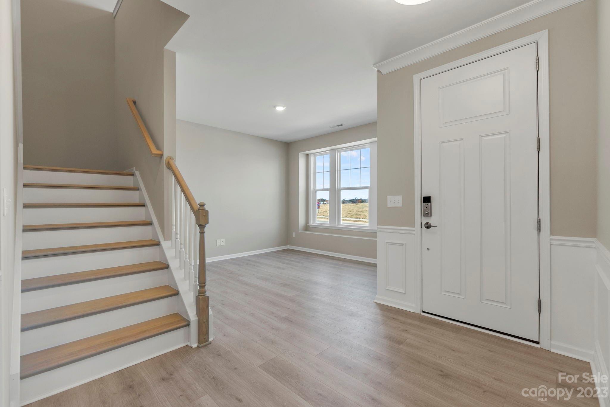 4130 Charlton Road Fort Mill, SC 29715 - Photo 3 of 24 a view of entryway with wooden floor and stairs