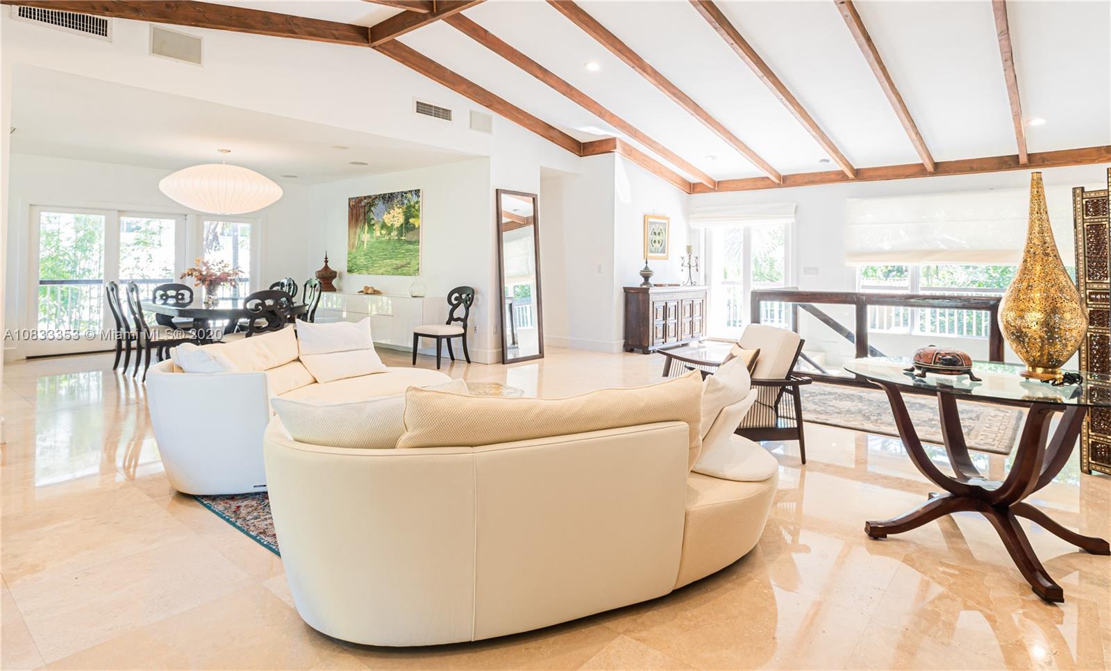 472 Warren Lane Key Biscayne, FL 33149 - Photo 14 of 39 a living room with a couch and a table