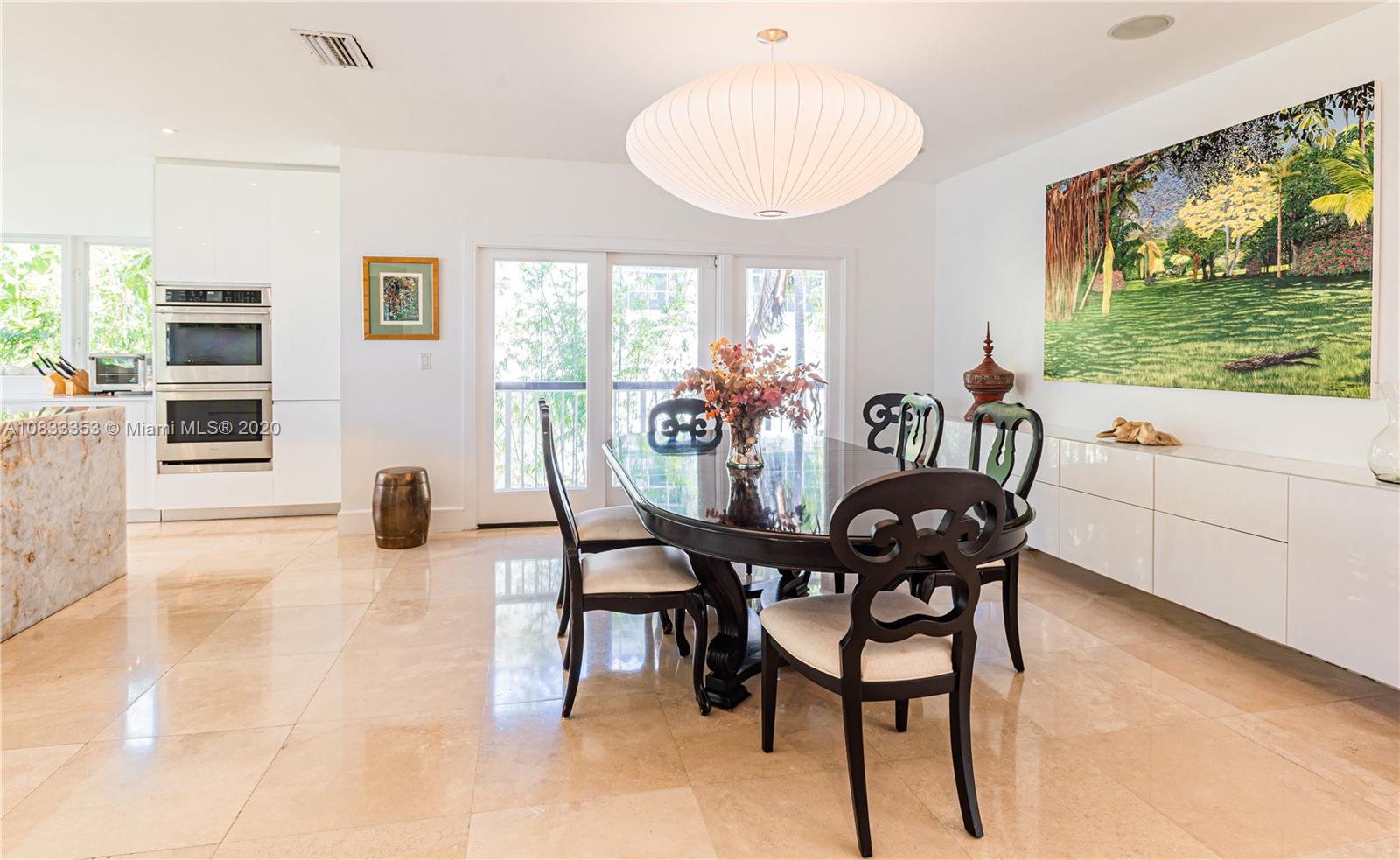 472 Warren Lane Key Biscayne, FL 33149 - Photo 15 of 39 a view of a dining room with furniture window and outside view