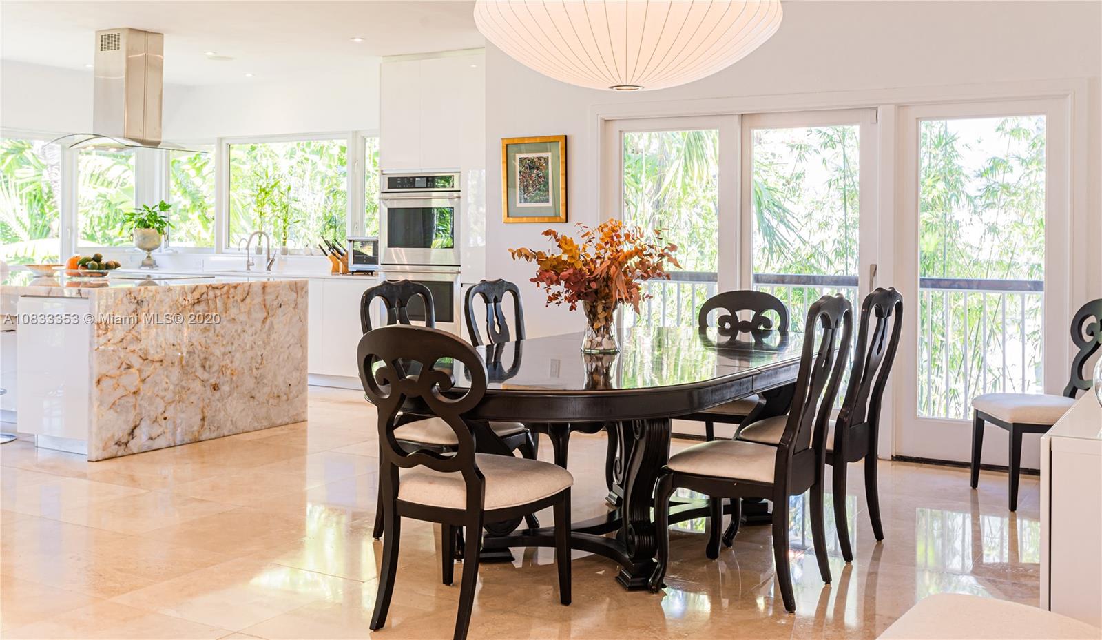 472 Warren Lane Key Biscayne, FL 33149 - Photo 16 of 39 a view of a dining room with furniture window and outside view