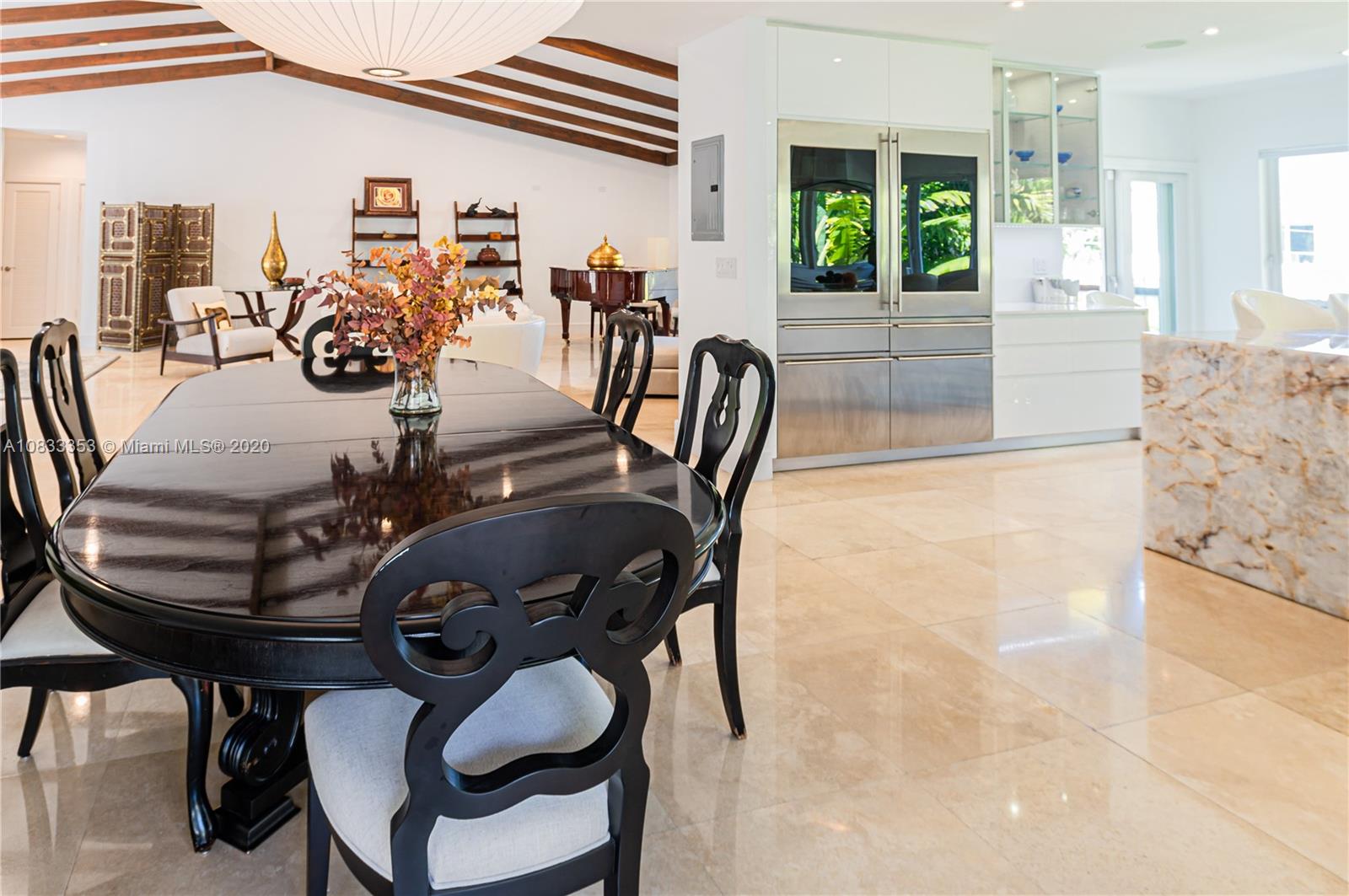 472 Warren Lane Key Biscayne, FL 33149 - Photo 17 of 39 a view of a dining room with furniture window and outside view